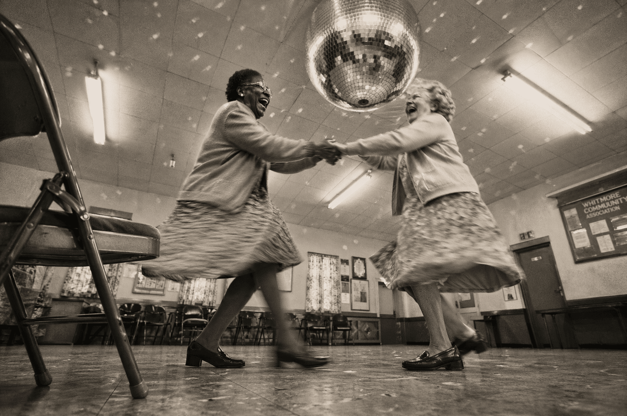 Two women dancing under a disco ball — GPT Image 2 render.