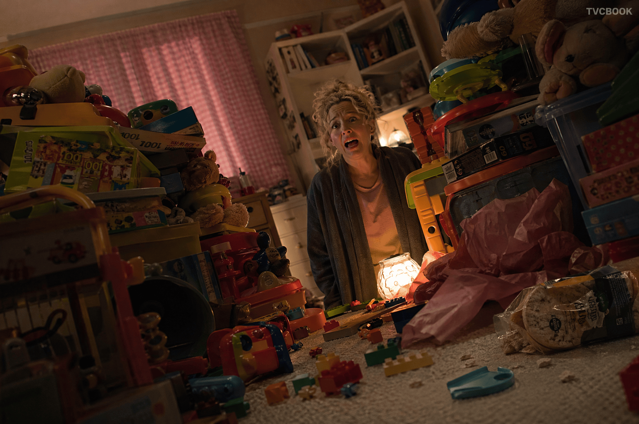 Narrative scene — woman in toy room.